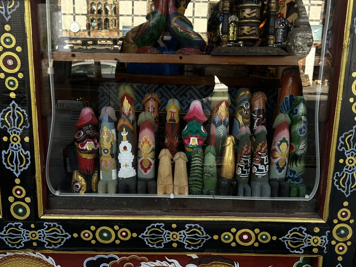 Carved masks and ritual figures in a handicraft shopfront