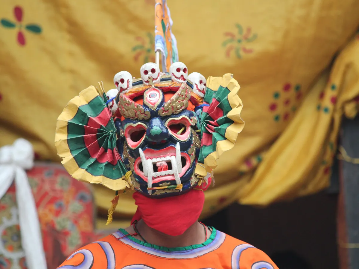 A festival mask waiting between dances
