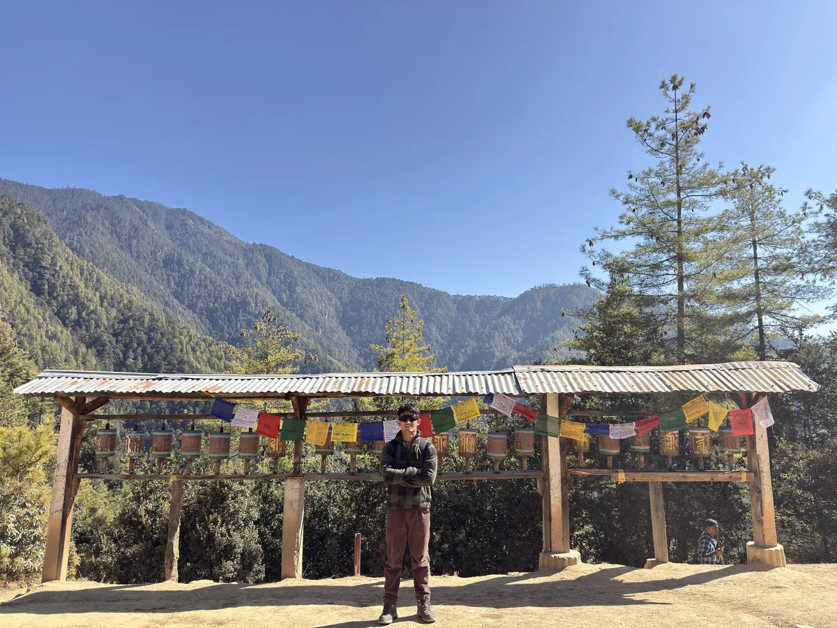 A prayer-flag gateway at the start of the walk