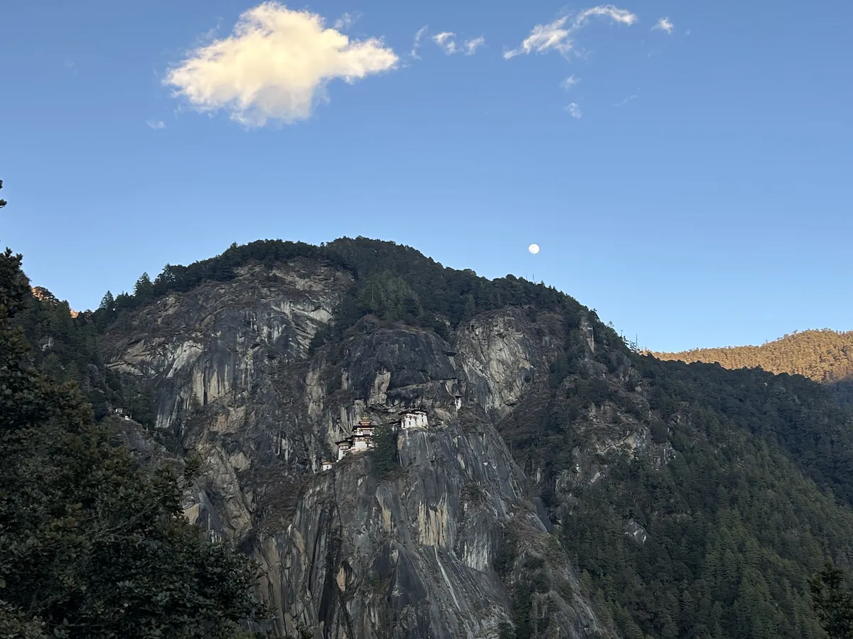 Taktsang across the gorge, the first cloud of the morning coming up the valley